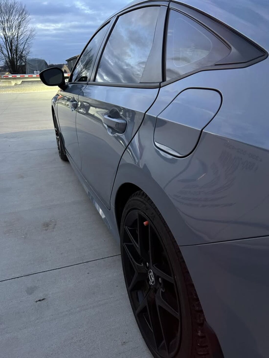 Detailed sedan exterior with clean wheels