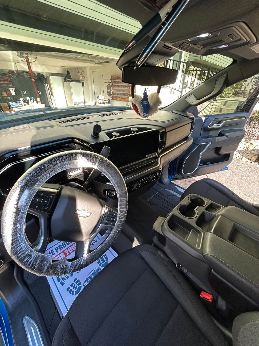 Clean dash and front seats of a detailed work truck